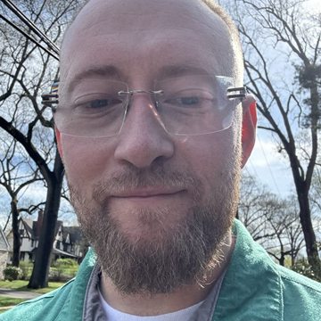 Ted Doubov, the maker of Pickscreen, smiling outdoors